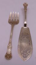 A pair of Victorian hallmarked silver fish servers, scroll pierced blades engraved with birds and