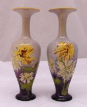 A pair of Doulton baluster vases decorated with flowers and leaves, marks to the bases 23.5cm (h)