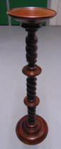 A mahogany plant stand, twisted and knopped stem on raised circular base, 96 x 25cm