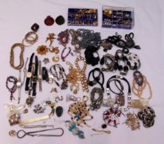 A quantity of costume jewellery to include earrings, necklaces, bracelets, bangles, brooches and