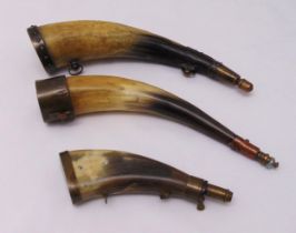 Three horn powder flasks of customary form