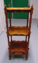 An Edwardian shaped rectangular three tier whatnot with single drawer all on original castors, 101 x