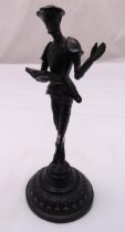 A cast metal figurine of Don Quixote on raised circular base, 20cm (h)