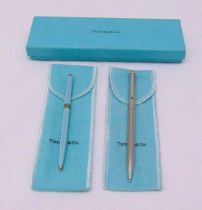 Tiffany and Co white metal ball point pen in original packaging and a Tiffany and Co enamel and