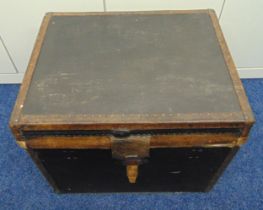 A rectangular leather bound trunk with studded hinged cover to reveal lined interior