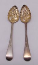 A pair of hallmarked silver berry spoons of customary form, approx total weight 127g