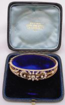 A Victorian pearl and rose diamond bangle, approx total weight 21.6g