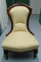 A Victorian mahogany upholstered ladies chair on original castors
