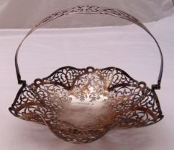 A hallmarked silver fruit dish with swing handle on three ball feet, approx total weight 197g,