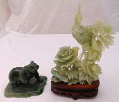 A jade figurine of a bear on carved stand and a carved hardstone figurine of birds and flowers on