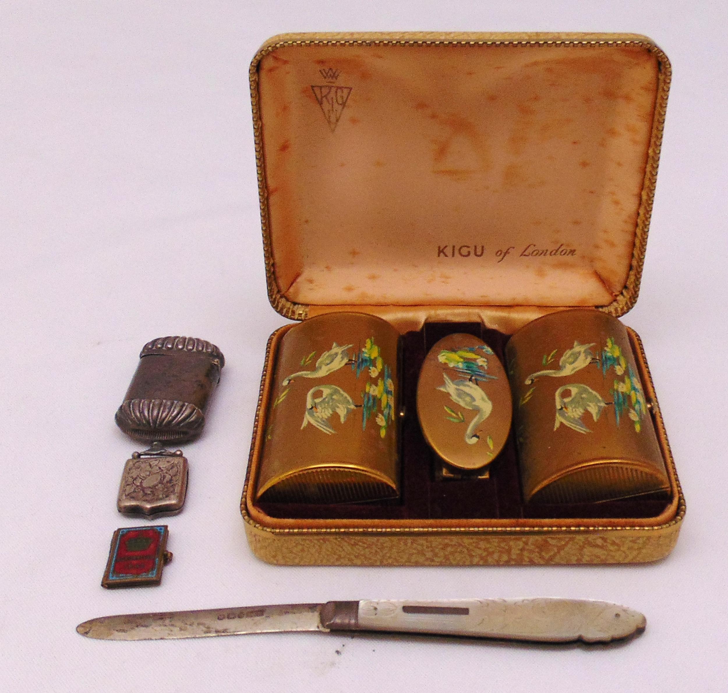 A quantity of collectables to include a hallmarked silver vesta case, a fruit knife with silver