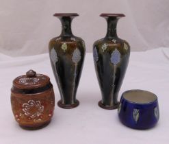 A pair of Royal Doulton green glazed stoneware vases with applied Art Nouveau floral motifs, incised