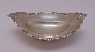 A Victorian oval hallmarked silver bonbon dish with applied shell and scroll border on reeded oval