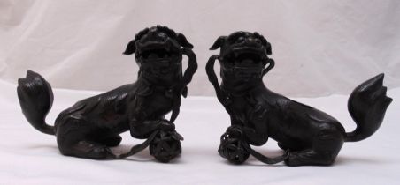 A pair of Ming style bronze figurines of Dogs of Foe, 15cm (h)