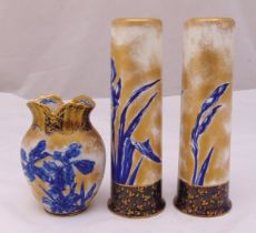 A pair of Doulton tubular vases decorated with flowers and leaves and matching vase, tallest 28cm (