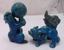 A pair of late Qing dynasty stylised turquoise glazed Lions, tallest 23cm (h)