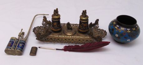 A gilt metal shaped rectangular desk stand with two inkwells surmounted by animal finials, a brass