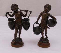 A pair of Auguste Moreau bronze figurines of children carrying baskets and urns on raised circular