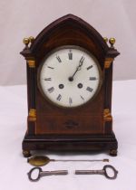 An Edwardian mahogany and satinwood inlaid mantle clock, of architectural form, white enamel dial