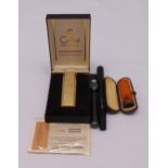 Swan fountain pen with metal sleeve, Colibri lighter in original case and a cheroot holder in