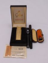 Swan fountain pen with metal sleeve, Colibri lighter in original case and a cheroot holder in