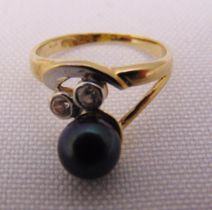 14ct gold ring set with a black pearl and diamonds, approx total weight 1.7g