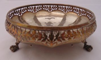 A hallmarked silver circular fruit bowl with leaf pierced sides on three claw feet, approx total