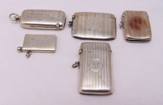 Four hallmarked silver vesta cases, various shape, form and decoration and a vesta case cum
