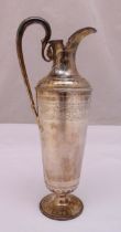 A Victorian hallmarked silver claret jug, tapering cylindrical form engraved with a band of stylised