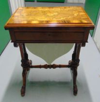 A Victorian rectangular mahogany, walnut and satinwood inlaid games table with a sewing drawer all