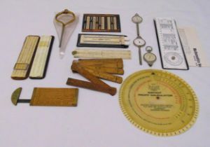 A quantity of antique measuring equipment to include slide rules and gauges (13)