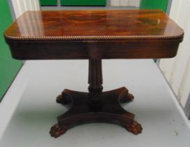 A late Victorian rectangular mahogany games table with gadrooned border, the quatrefoil base with