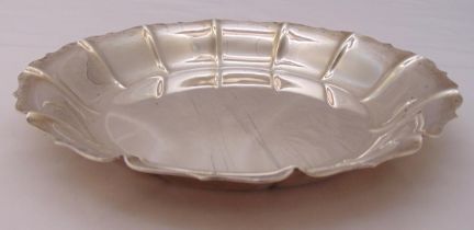 An American white metal circular dish with crimped border, stamped sterling, approx total weight