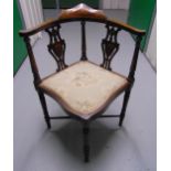 A mahogany upholstered music chair on four turned legs