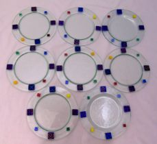 Eight Murano glass plates with polychromatic geometric borders, 26cm (w)