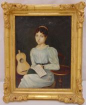 An early 19th century framed oil on canvas portrait of a seated lady holding a music manuscript with