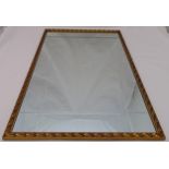 A framed rectangular bevel edged wall mirror, 96 x 65cm