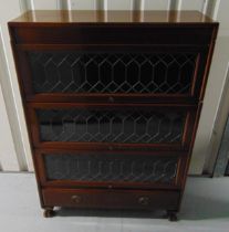 An early 20th century Globe Wernicke style bookcase with three lead lined glazed shelves and a
