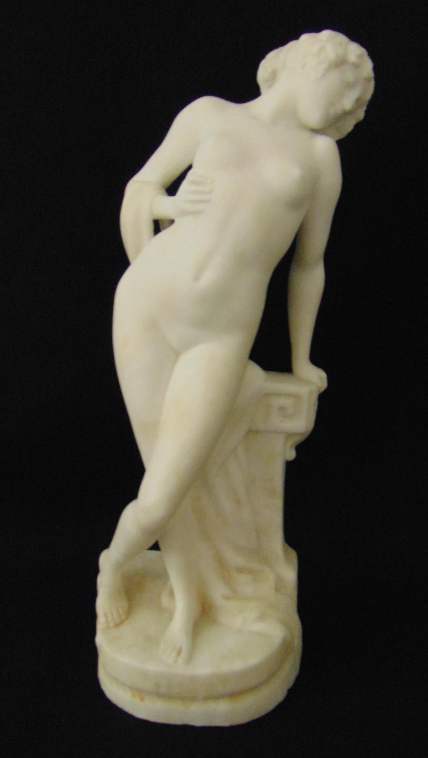 Seger marble figurine of a nude lady on shaped oval base, label to verso for M Klein of Paris , 27cm