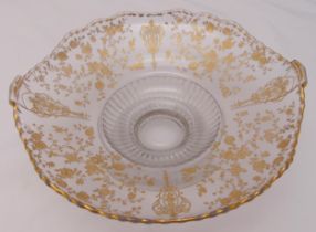A continental glass fruit bowl, shaped circular with gilded flowers leaves and scrolls, 31.5cm (w)