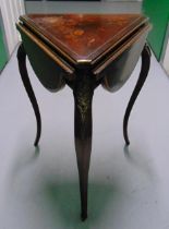 A 19th century triangular drop flap table, the hinged cover opens to reveal a mirror and material
