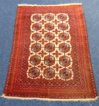 A Persian wool carpet, red and cream with repeating geometric pattern and border, 160 x 105cm