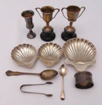 A quantity of hallmarked silver to include three bonbon dishes, two trophy cups, a Kiddush cup, a