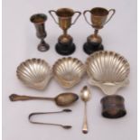 A quantity of hallmarked silver to include three bonbon dishes, two trophy cups, a Kiddush cup, a