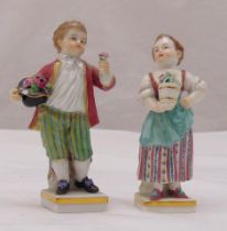 Two Meissen figurines of children holding flowers, marks to the bases, 10.5cm (h)