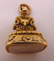 A Regency gold plated seal set with a carved white stone