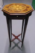 An Edwardian octagonal mahogany plant stand with satinwood inlays on four tapering rectangular legs,