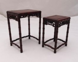 A miniature nest of two hardwood oriental stands on faux bamboo legs, tallest, 23.5x 17.5 x 13cm