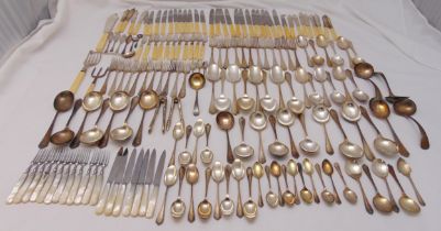 A quantity of silver plated flatware to include knives, forks, spoons and a serving knife and fork