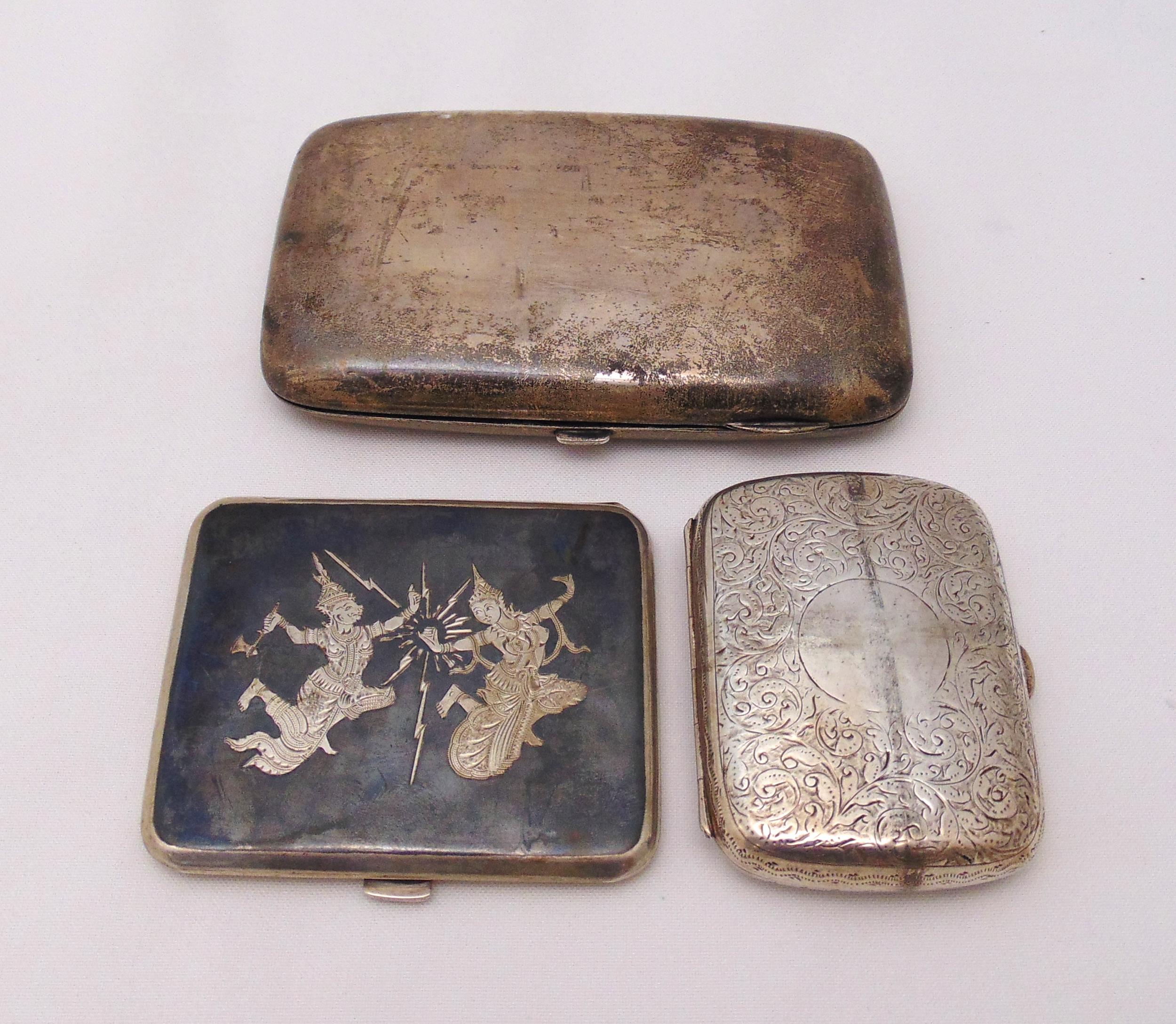 A hallmarked silver cigarette case, a hallmarked silver cheroot case and a Thai white metal and